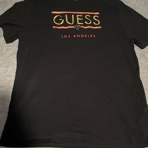 GUESS BLACK SHIRT XXL BUT FIT IS MORE LIKE XL.
